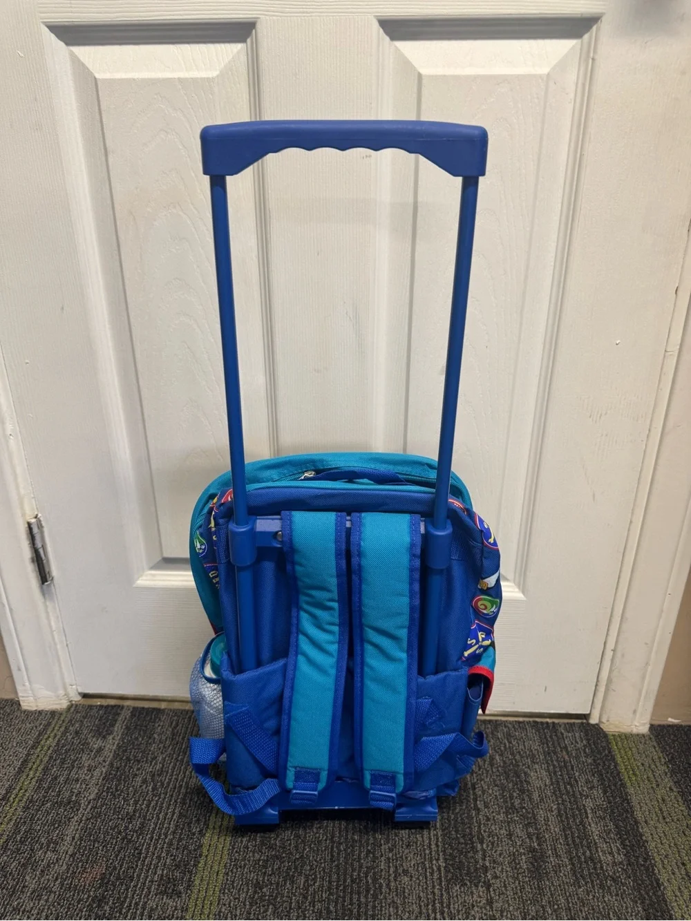 Vintage Scooby-Doo rolling backpack features a pilot graphic of Scooby-Doo
